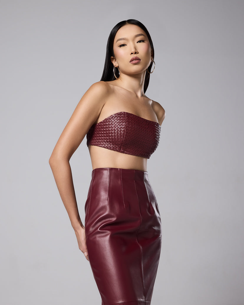 Burgundy leather maxi skirt styled with a matching woven bandeau top