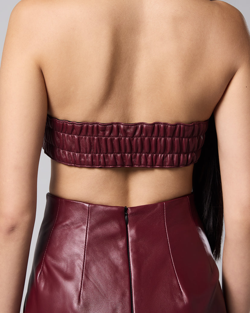 Burgundy woven bandeau with an elasticated back, styled with the matching leather skirt