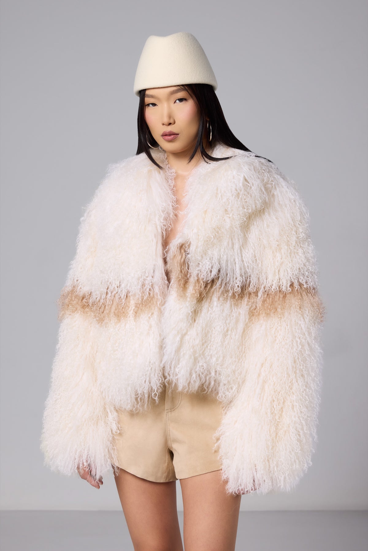 Nola ivory Mongolian fur jacket with a contrasting warm brown stripe, photograph 6873