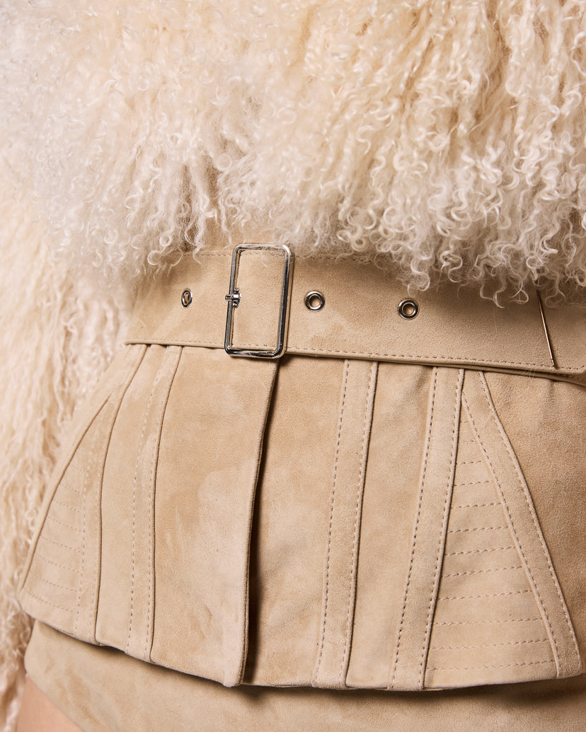 Close-up of the integrated corseted waist and buckle belt on the Sigrid jacket